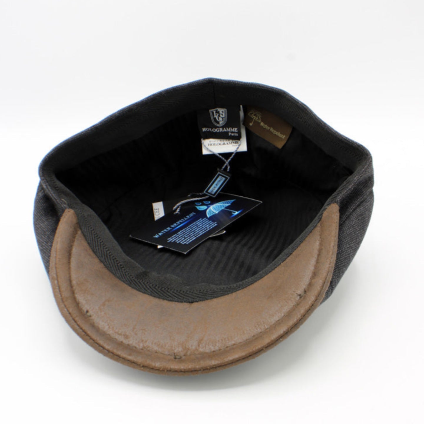 The "RainRunner" - Black Newsboy Cap by Hologramme Paris