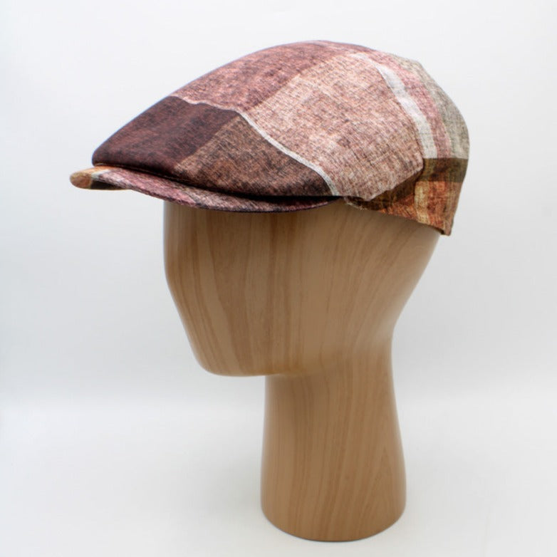 The "Big Plaid - Reds” Flat Cap by Hologramme Paris