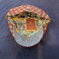 Interior of Rudy flat cap with colorful paisley lining and blue-gray underbrim