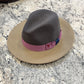 Indiana fedora with charcoal gray crown, tan brim and mauve band with navy accent