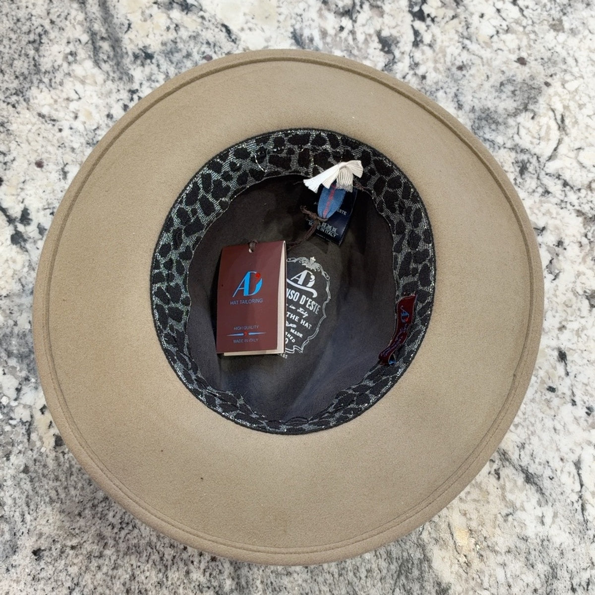Interior of Indiana fedora showing patterned sweatband and tan brim