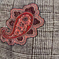 Close-up of red paisley and black-and-white check fabric on cap 42108