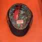 Interior with colorful animal-print lining and Harris Tweed label