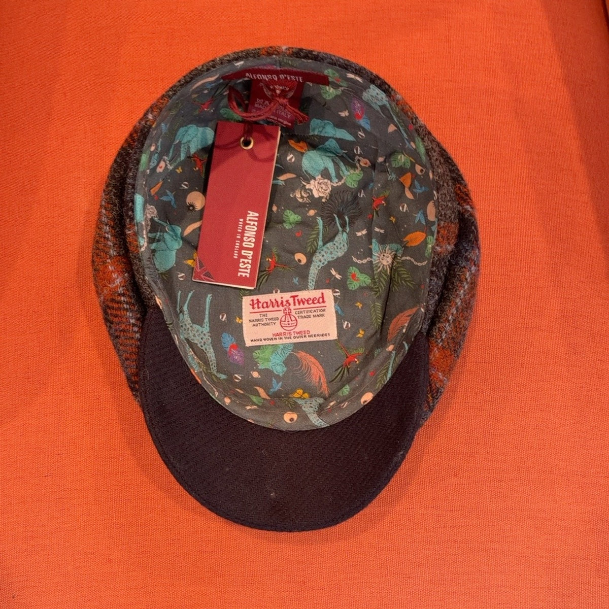 Interior with colorful animal-print lining and Harris Tweed label
