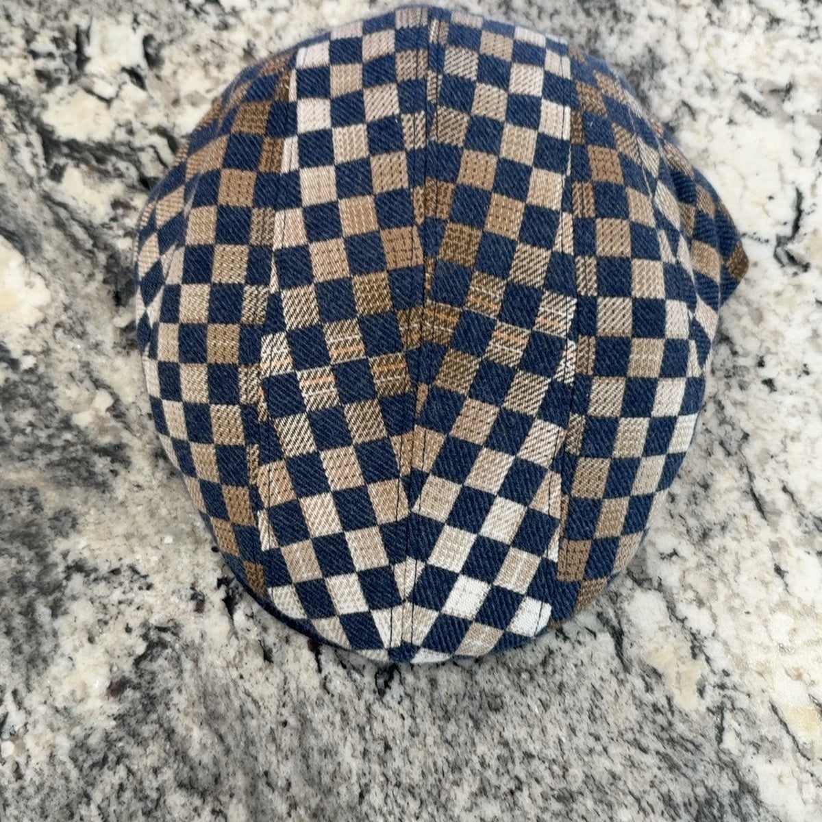 Alfonso d’Este John blue, tan and cream checkerboard flat cap 47545, top view