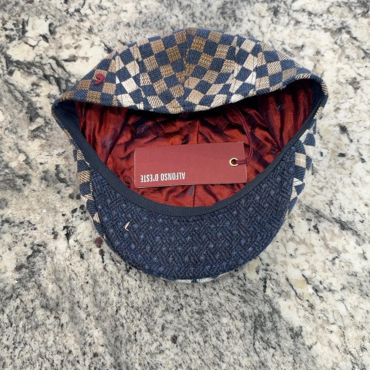 Alfonso d’Este John blue checkerboard flat cap 47545 showing burgundy lining and blue underside of brim