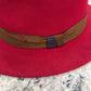 Brown ribbon band and navy accent on Alfonso D’Este red fedora 47824