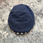 Front view of navy Ionio flat cap