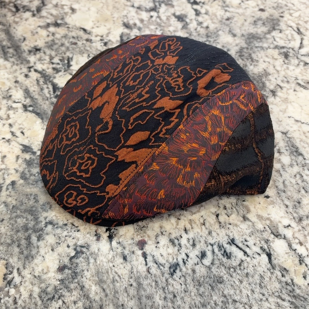Alfonso d’Este John 52062 black rust and orange patchwork flat cap