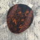 Top view of John 52062 black rust and orange patchwork flat cap