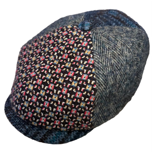 Harris Tweed cap with a patterned front and textured back on a white background