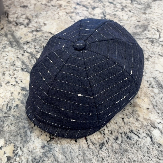 Alfonso d’Este Shelby 52254 navy newsboy with orbit-like pale stripes and flecks