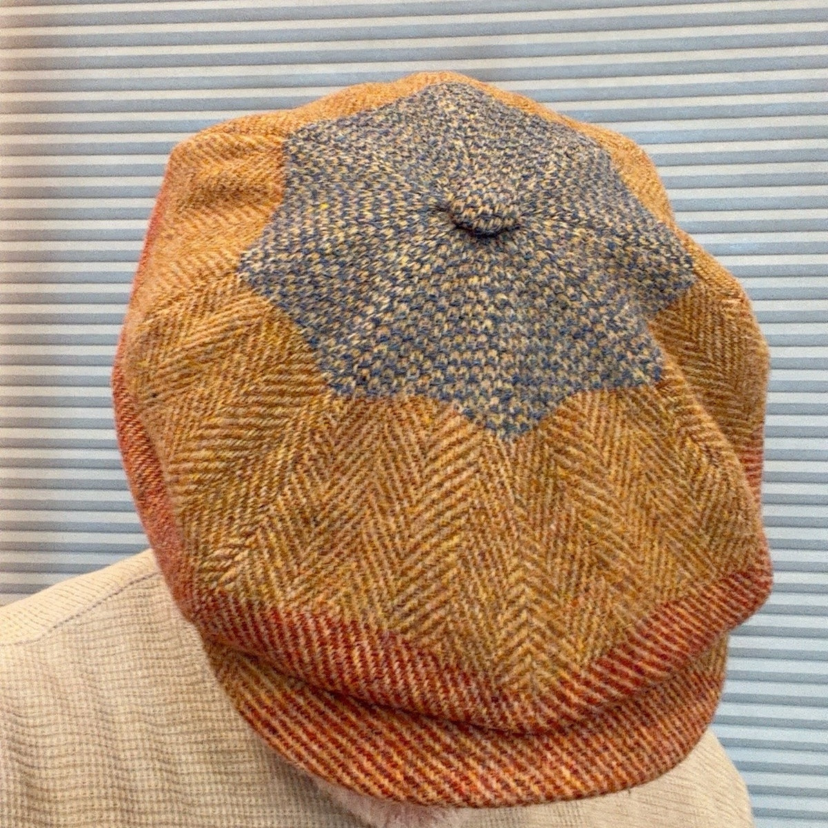 Alfonso d’Este Kyoto gold, rust and blue virgin wool newsboy cap 52281, crown detail shown worn