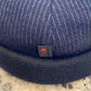 Textured blue fabric and navy rolled edge on Docker cap 52456