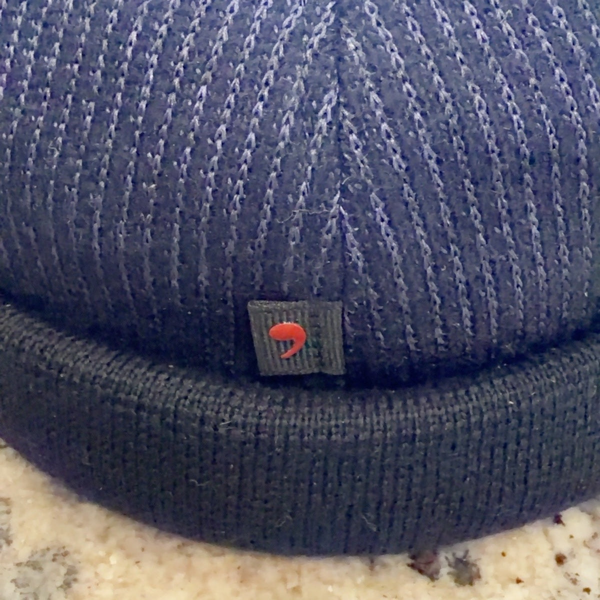 Textured blue fabric and navy rolled edge on Docker cap 52456