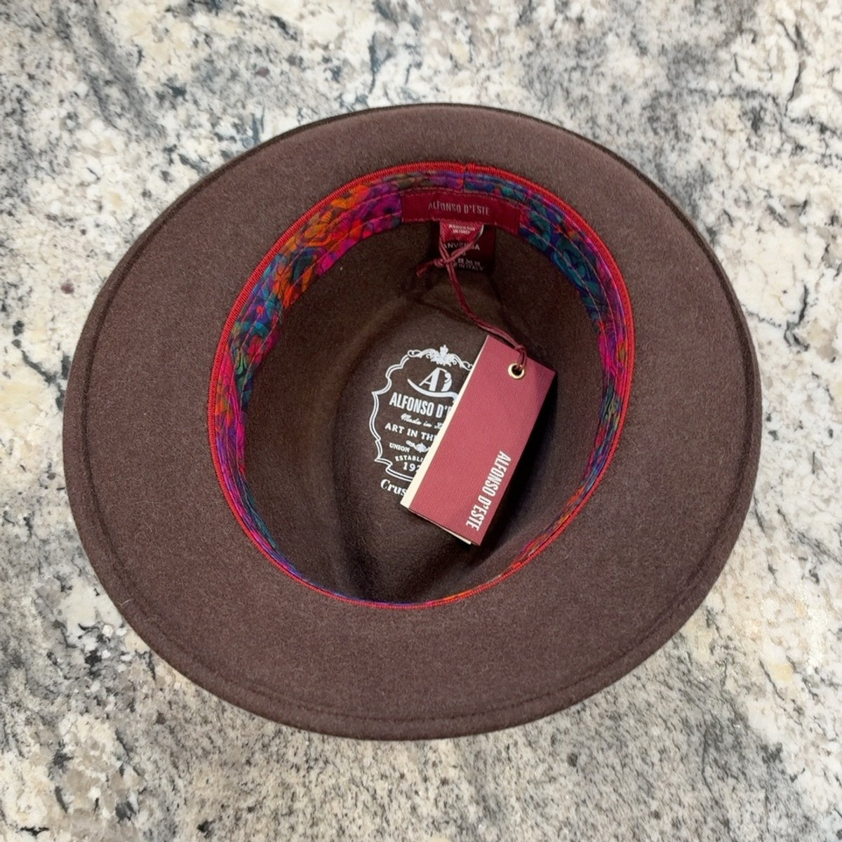 Interior of Anversa fedora showing colorful sweatband and crushable marking