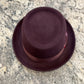 Top view of burgundy pork pie hat