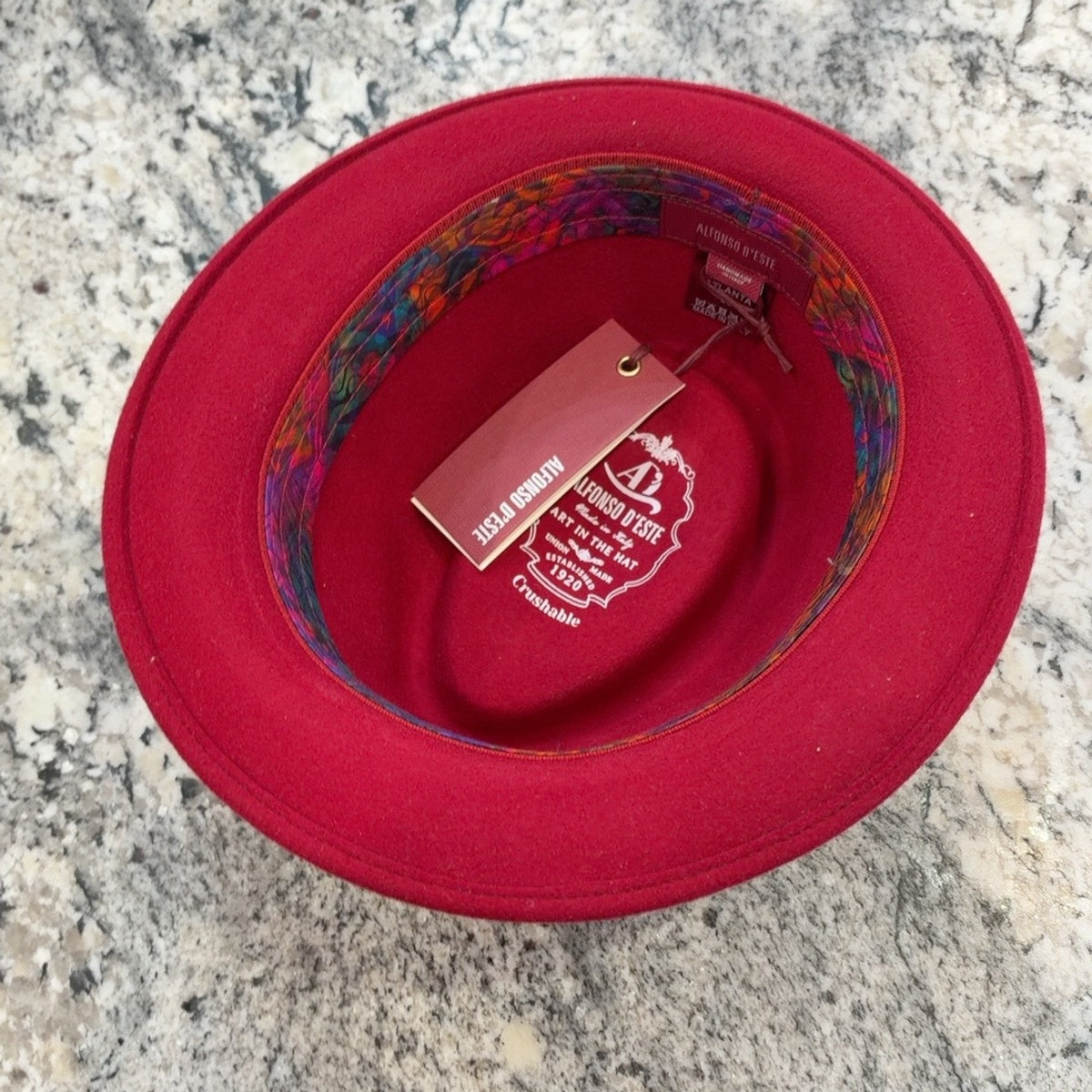 Interior of red Alfonso D'Este Atlanta fedora 52821 showing patterned sweatband and crushable marking