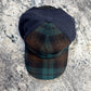 52888 Trucker cap front view showing plaid brim and navy crown panels