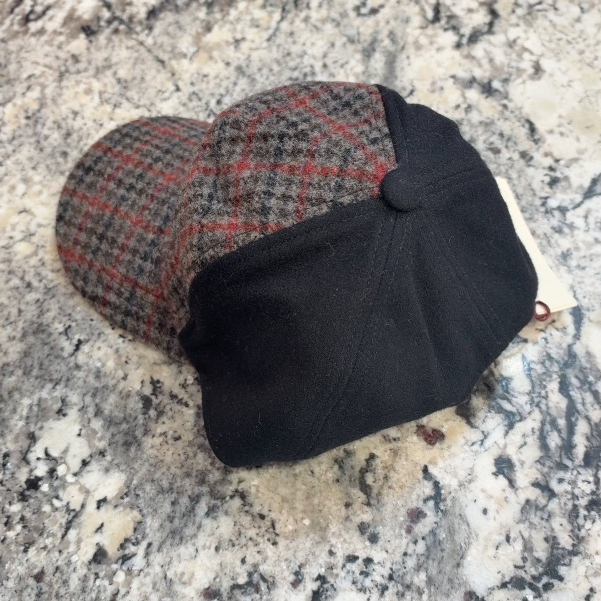 Side and crown of 53194 showing black panels and gray red check fabric