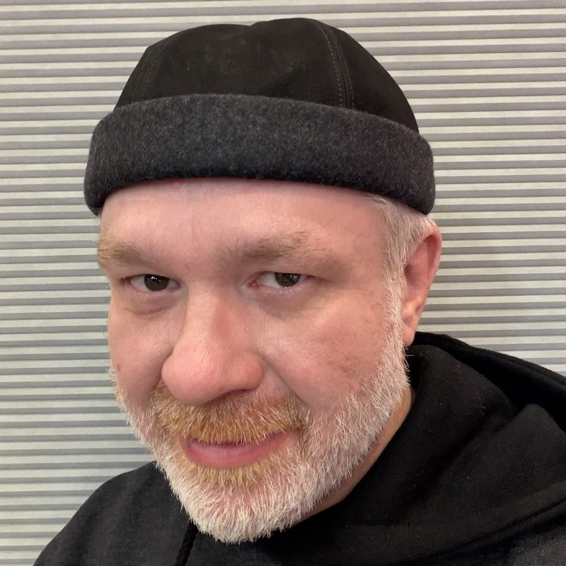 Alfonso d’Este black leather and charcoal Docker cap 55527 worn on a model