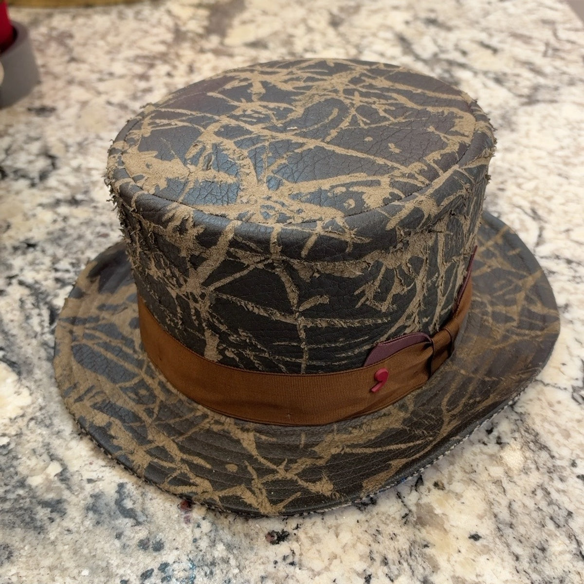 Alfonso d’Este Cilindro distressed leather top hat in charcoal and tan 56053