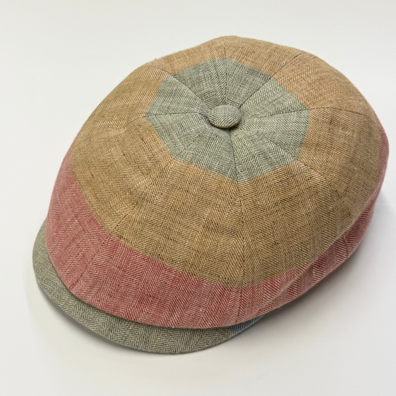 Multicolored cap with a geometric pattern on a white background