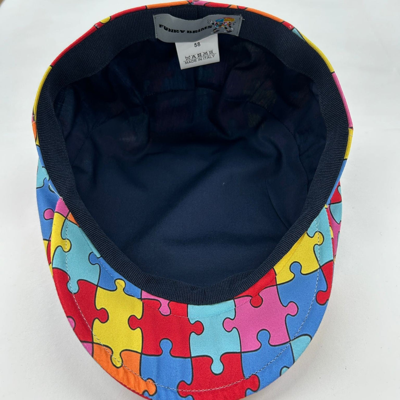 Autism awareness puzzle piece cap by FunkyBrims. 
