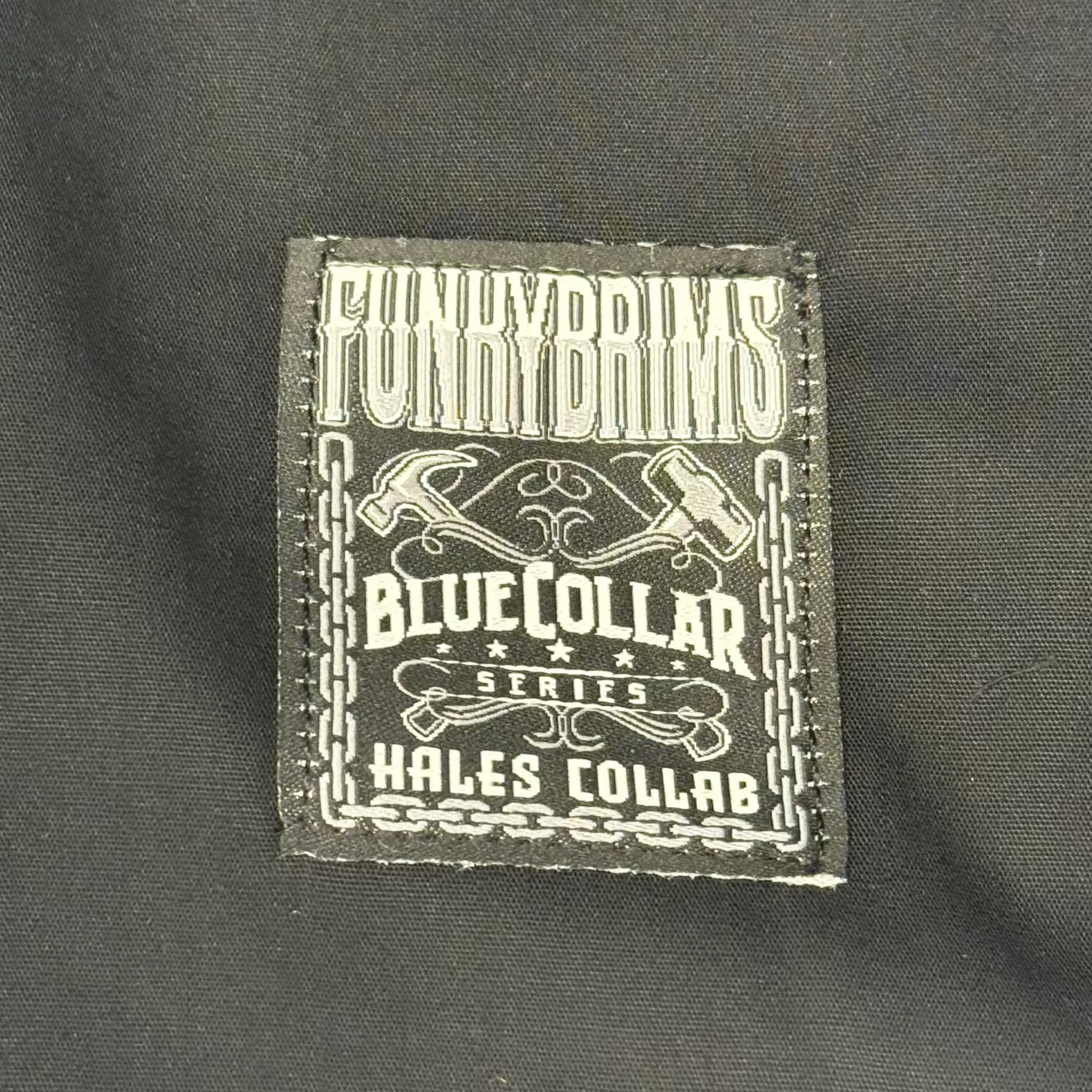 Label with text on a dark fabric background