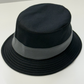 Black fedora hat with a gray band on a white background