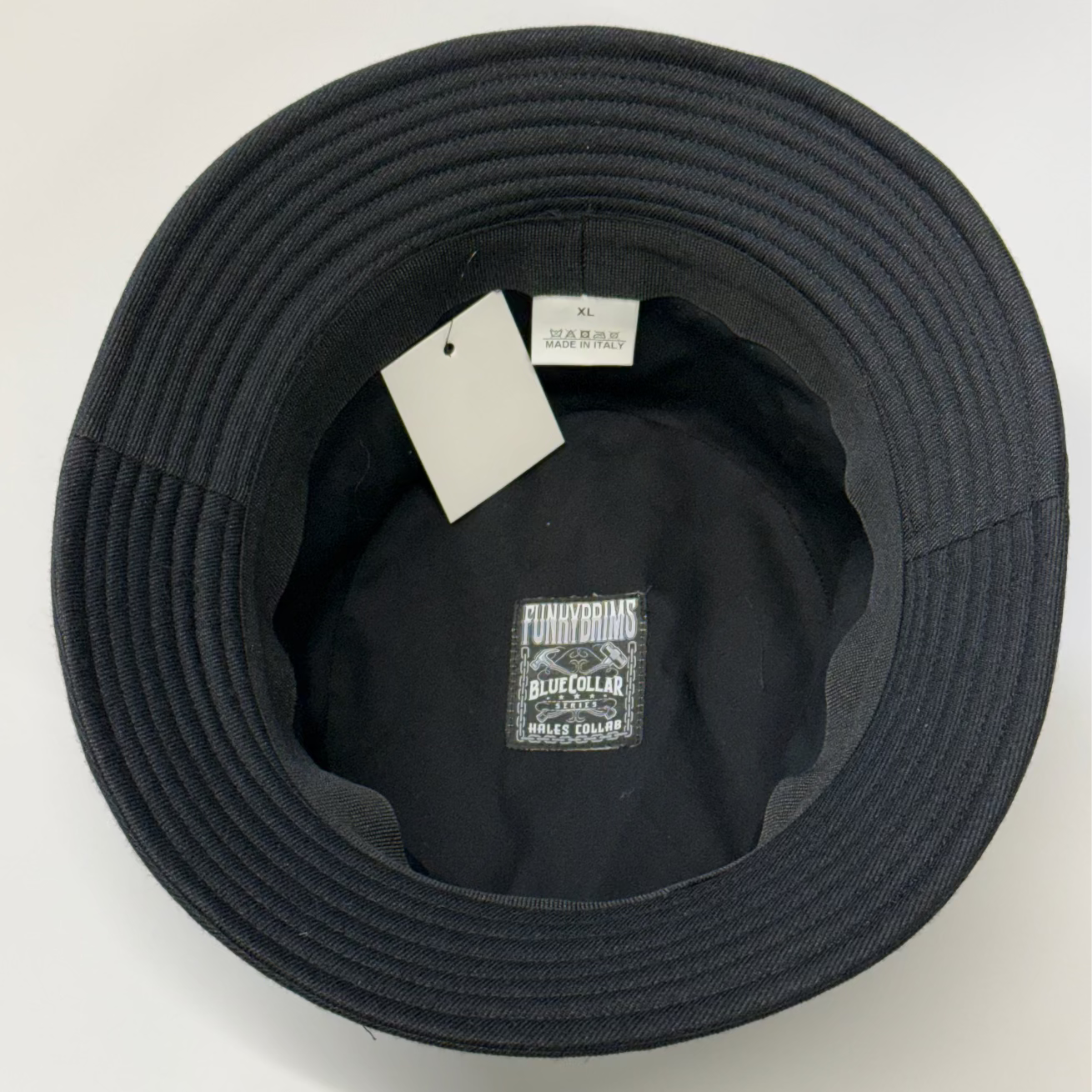Black hat with tags on a white background
