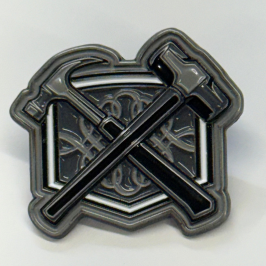 Metallic emblem with crossed axes on a white background
