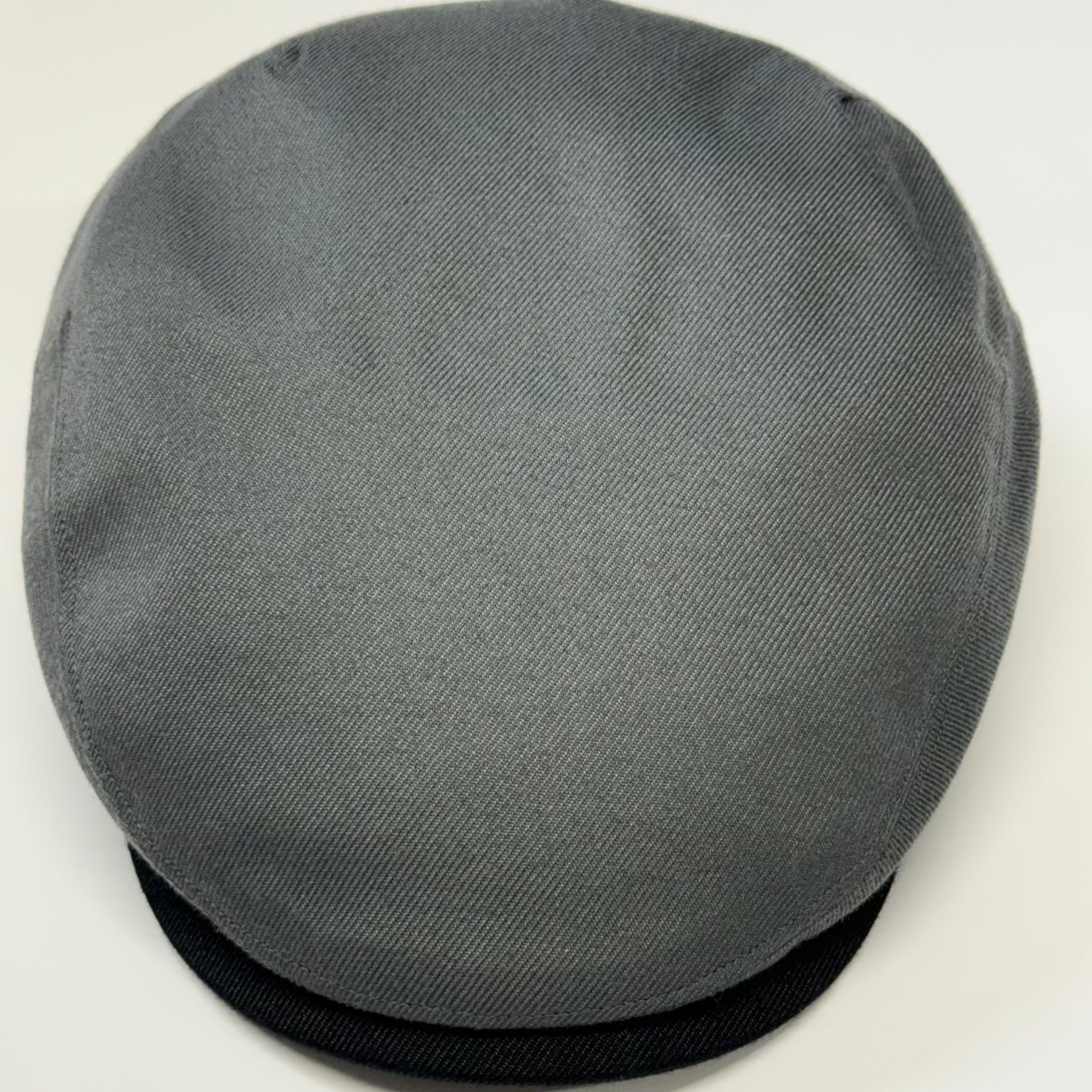 Gray flat cap on a white background