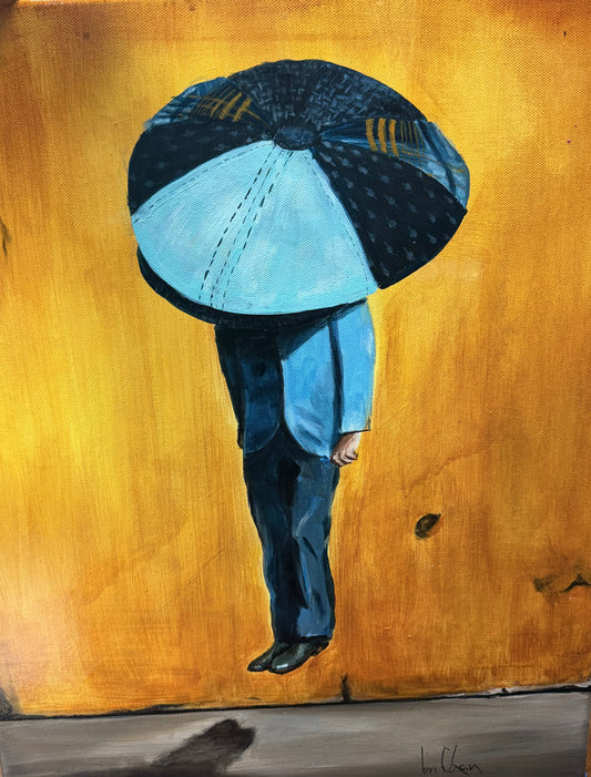 Person holding a large blue umbrella against a yellow background