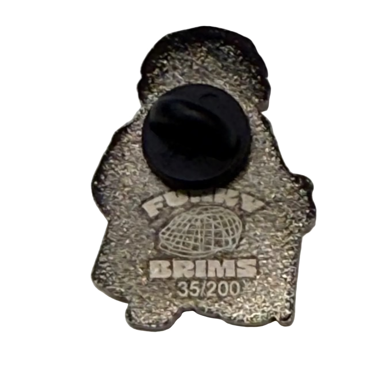 A small metallic badge or pin shaped like a ghost, with a black plastic fastener on top. The badge has a textured silver-gray finish and is printed with the words 'FUNKYBRIMS' and '35/200' along with a globe graphic.