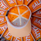 An orange baseball cap shown from above, with a beige visor and a white crossbar. The inside of the cap features orange panels with white and red 'HALES' text, and a black brand tag on the side.