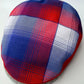 Plaid-patterned headband with red, blue, and white colors on a light gray background