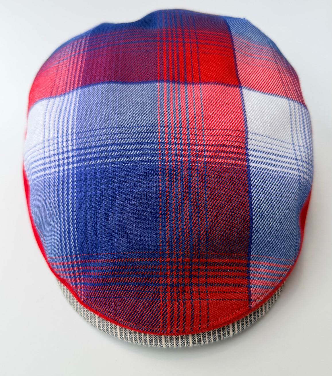 Red and blue plaid fabric on a white background