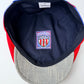 Cap with a logo on the back against a white background