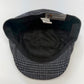 A vintage-style flat cap with a black and gray houndstooth pattern, featuring a black plush fleece lining and a visible 'Every Day' brand tag inside the crown.