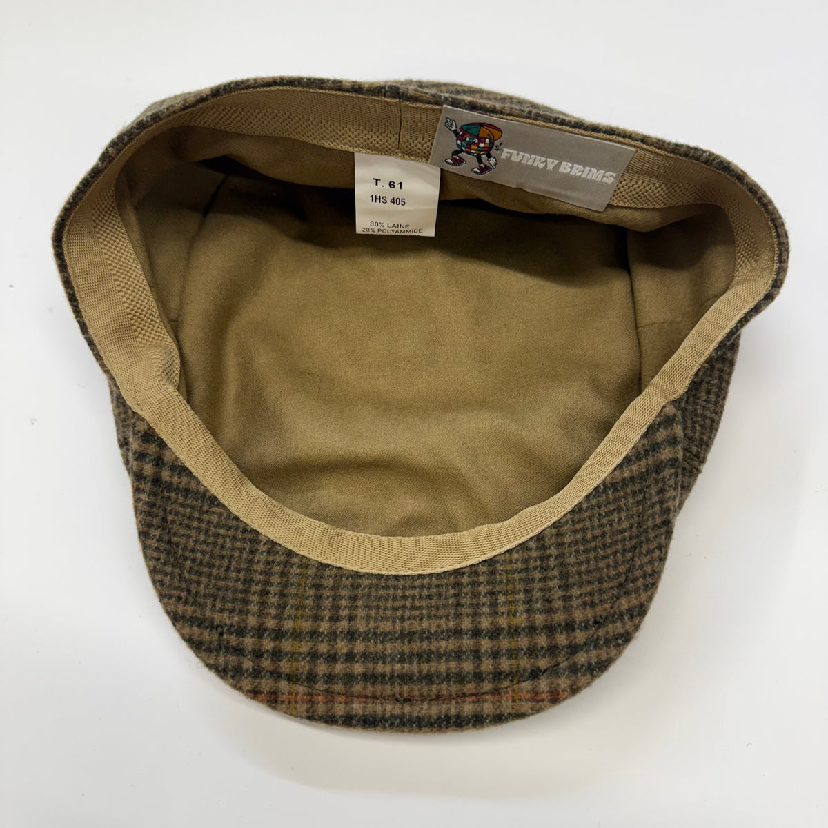 A vintage-style flat cap with a brown and black houndstooth patterned exterior and a tan interior. The brand label 'FUNNYBRIMS' is visible on the inner crown, along with a size tag