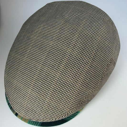 Checkered flat cap on a white background