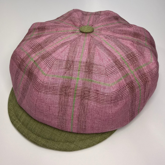 Purple checkered cap with green base on a white background