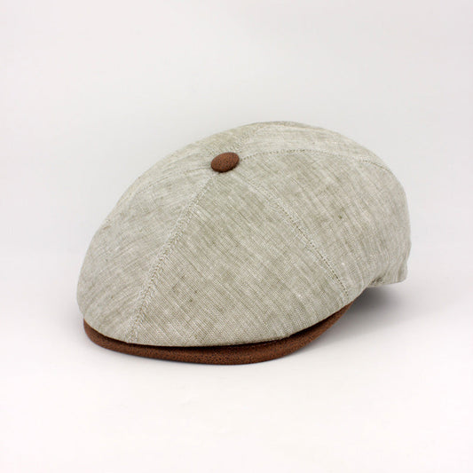 The LinenShelby – Sage by FunkyBrims, a light green linen-style flat cap with warm brown accents and a classic Shelby-inspired silhouette.