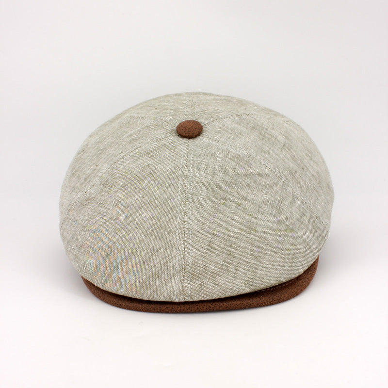 The LinenShelby – Sage by FunkyBrims, a light green linen-style flat cap with warm brown accents and a classic Shelby-inspired silhouette.