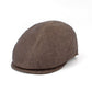 A brown textured flat cap or newsboy-style hat photographed on a clean white background.