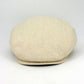 Beige flat cap on a white background