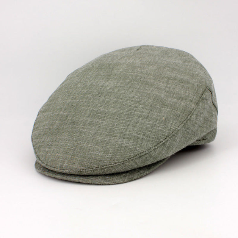 Green flat cap on a white background