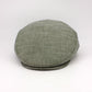 Green flat cap on a white background