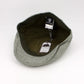 Green cap with a tag on a white background